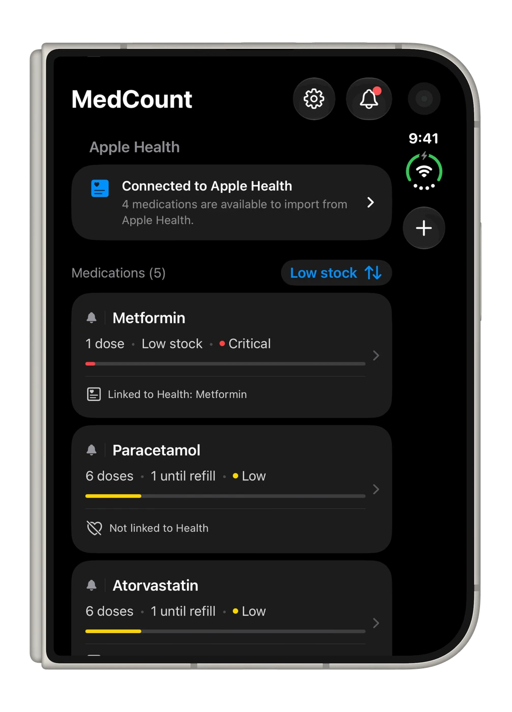 MedCount medication list on a folded iPhone Duo in dark mode